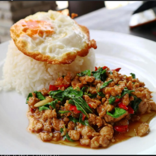 Thai stir fries basil top with egg( ข้าวราด กระเพา)
