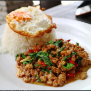 Thai stir fries basil top with egg( ข้าวราด กระเพา)